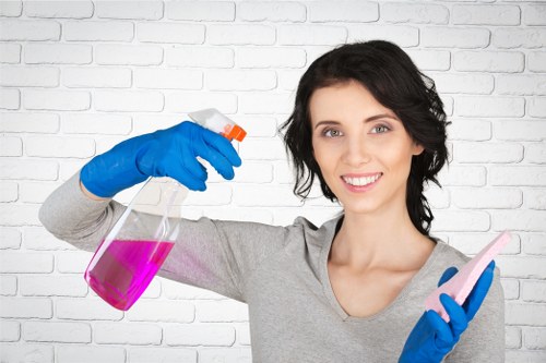 Technician performing deep carpet cleaning in a commercial workspace