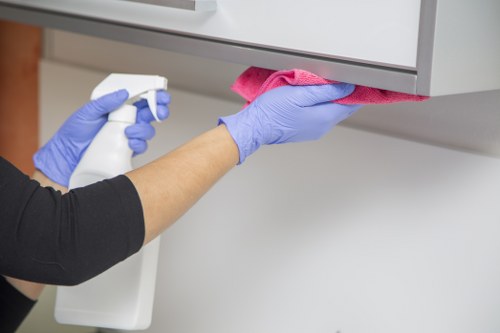 Blotting a fabric stain with a clean cloth